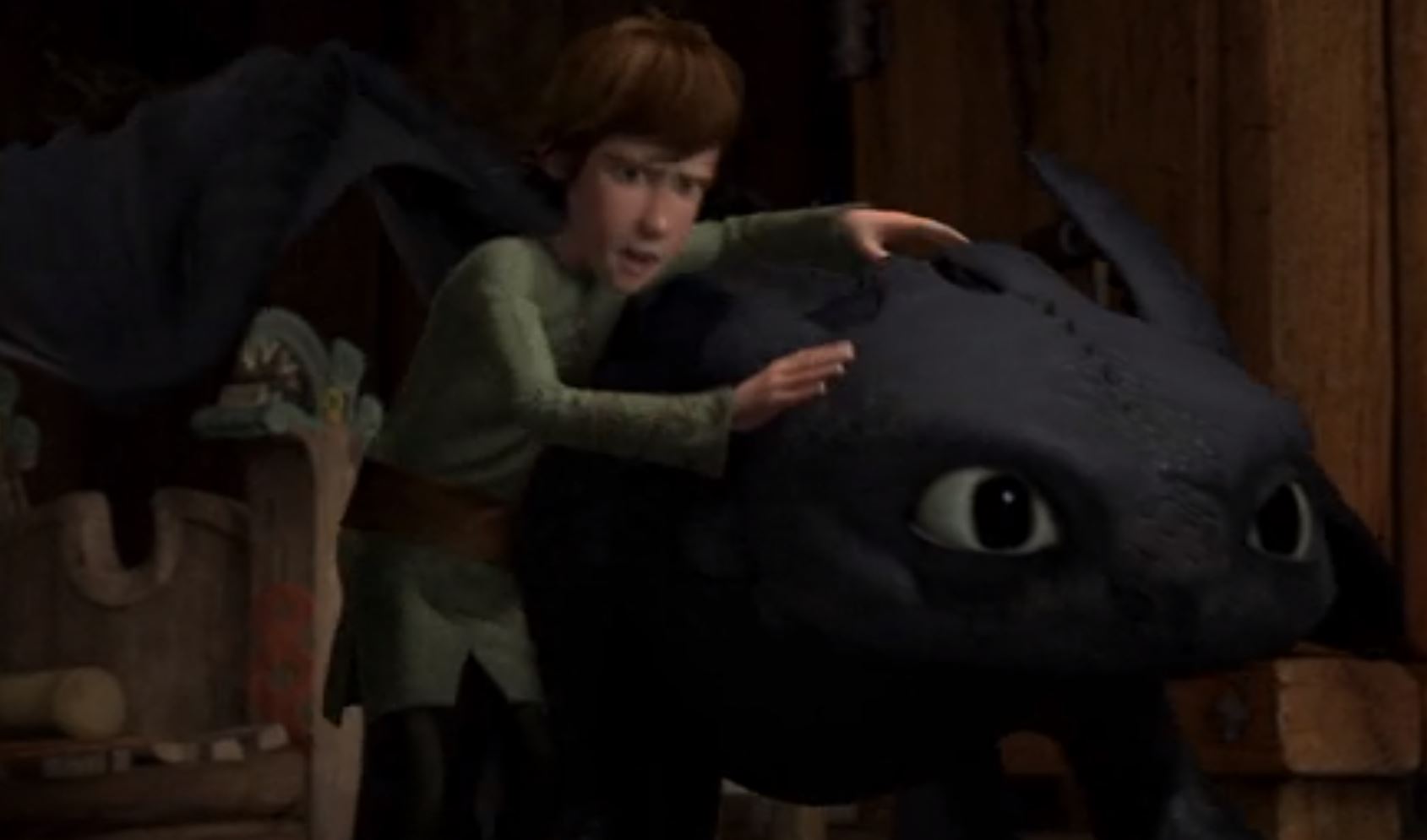 hiccup holding onto toothless