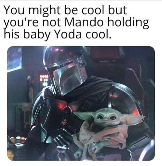 mando holding baby yoda cool